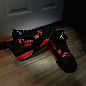 Thunder red Jordan 4s